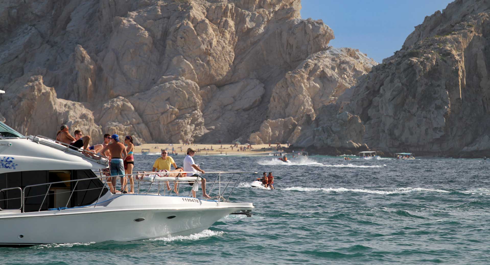 Tourists enjoy a party boat pleasure cruise in Cabo San Lucas