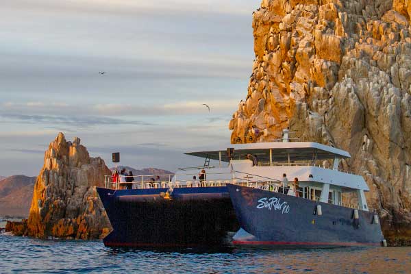 Sunrider tour boat in Cabo at Land's End